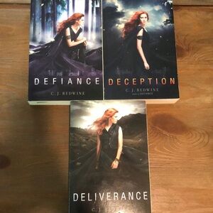 Defiance, Deception, Deliverance Trilogy series by C.J. Redwine. paperbacks